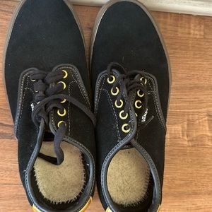 Black suede with gold trim vans tennis shoes. Looks great. Very comfortable!